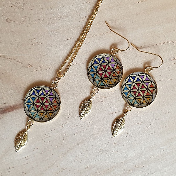 Boucles d'oreille pendantes fleur de vie et feuille or