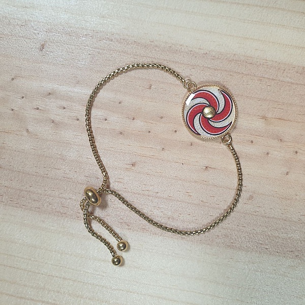 Bracelet r&eacute;glable enluminure spirale rouge et or