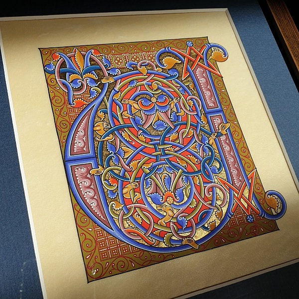 Romansk illuminert bokstav U innrammet