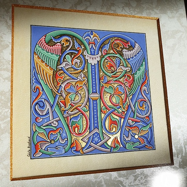 Romansk illuminert bokstav M innrammet