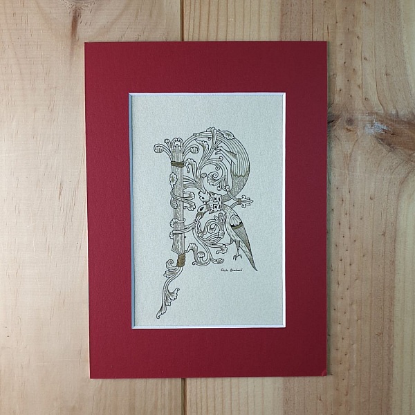 Belyst bokstav R i romansk stil